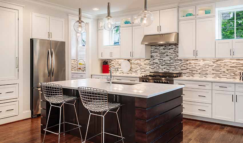 Black and White Kitchen Island with Added Stools